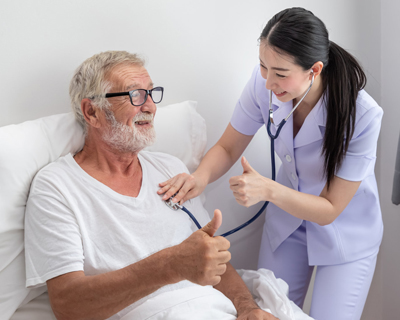 a nurse checking the blood pressure of a senior man