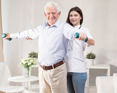 a physical therapist and a senior man doing physical therapy