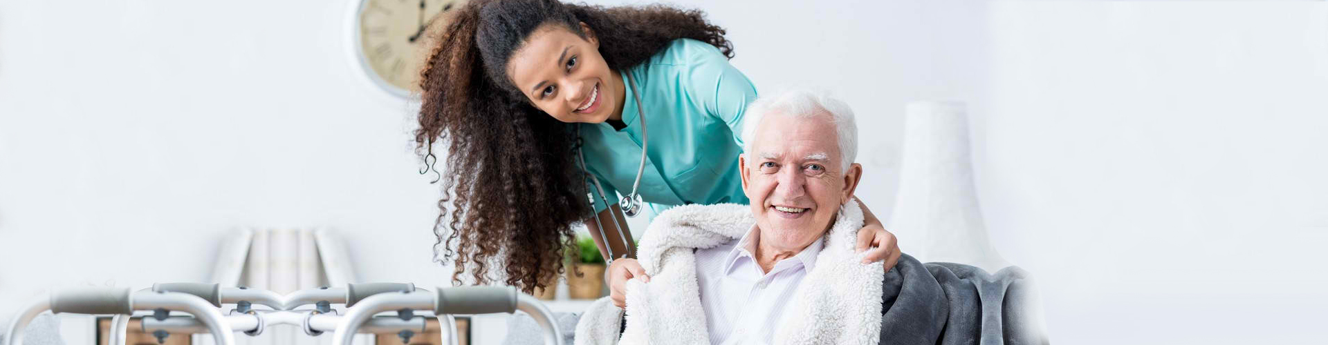 a nurse and a senior man smiling