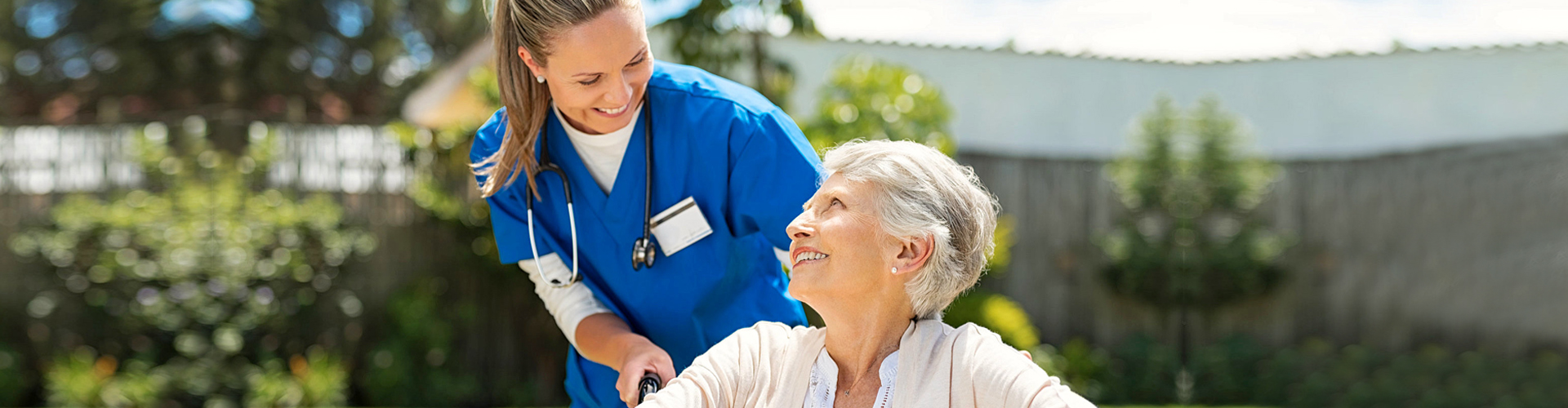 a nurse assisting a senior woman