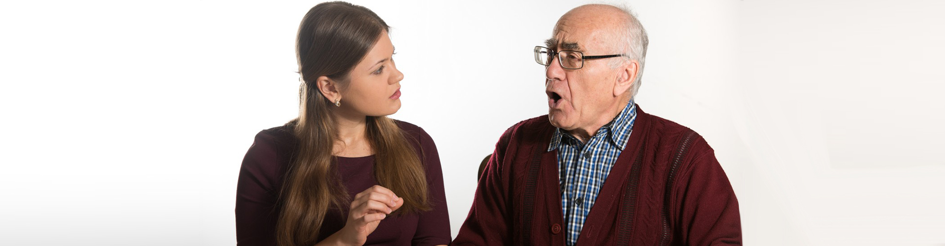 a speech therapist and a senior man doing speech therapy